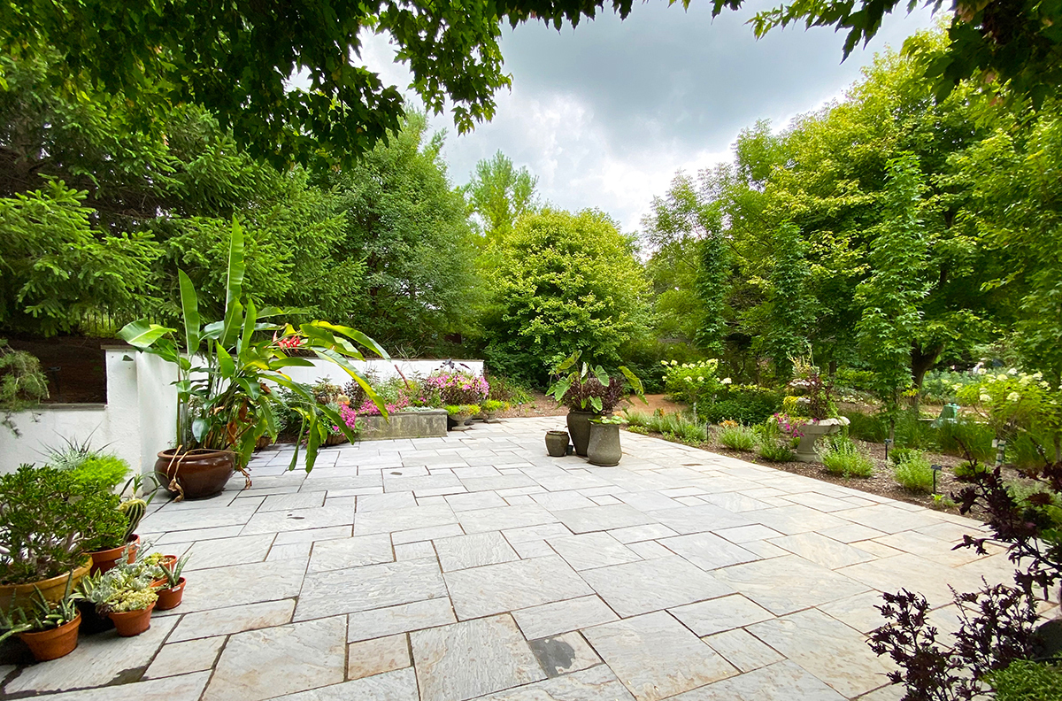 CoHorts Patio Garden with concrete pavers and containers with plants