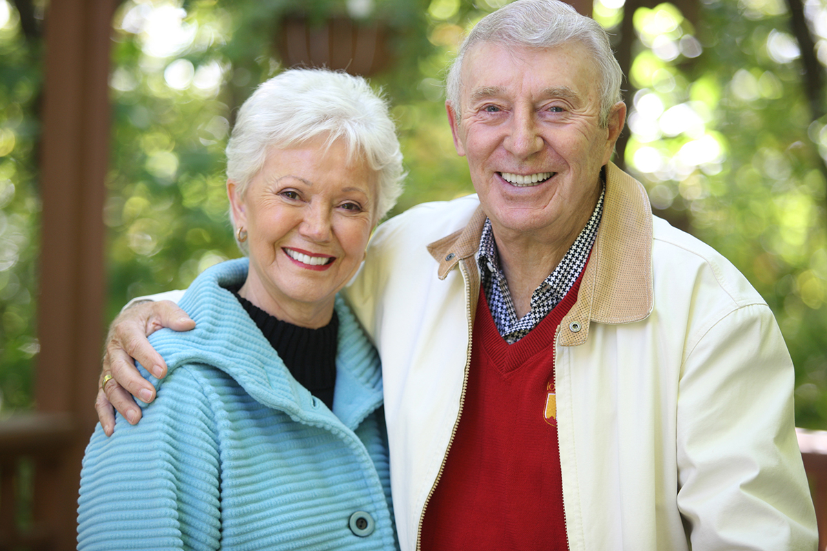  Roy and Bobbi Reiman smiling with their arms around eachother