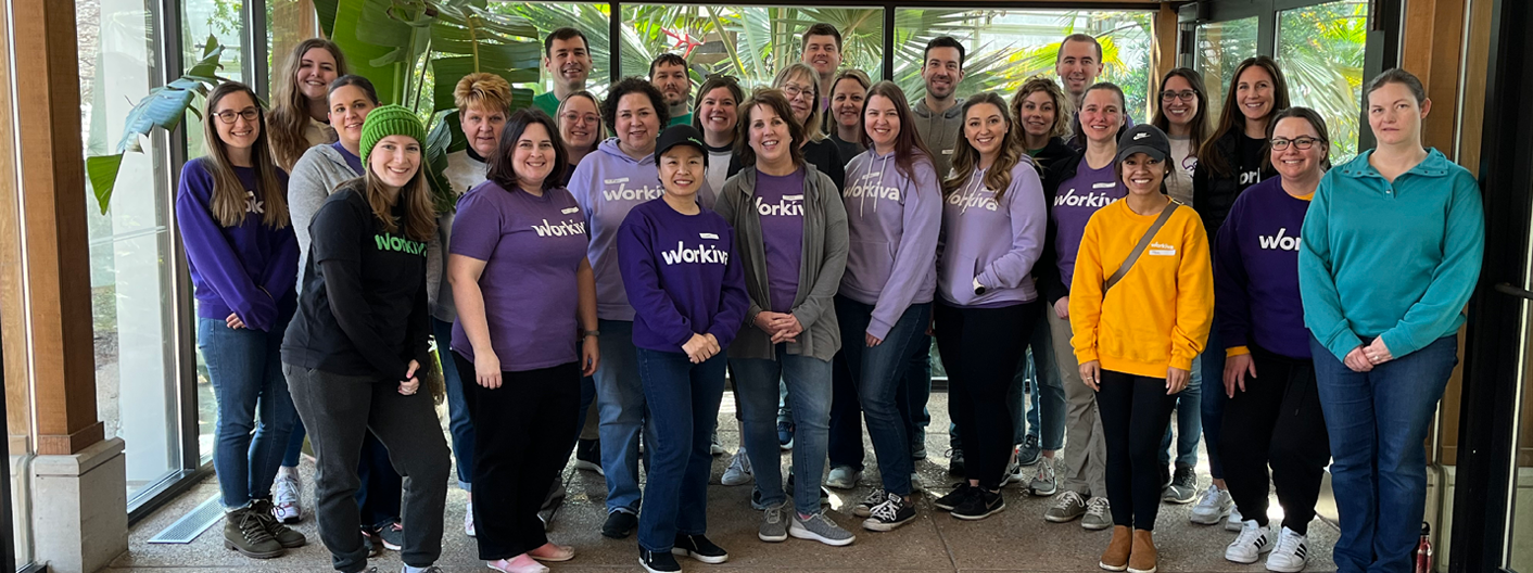 Workiva Day of Service volunteers pose as a group in front of the Conservatory.