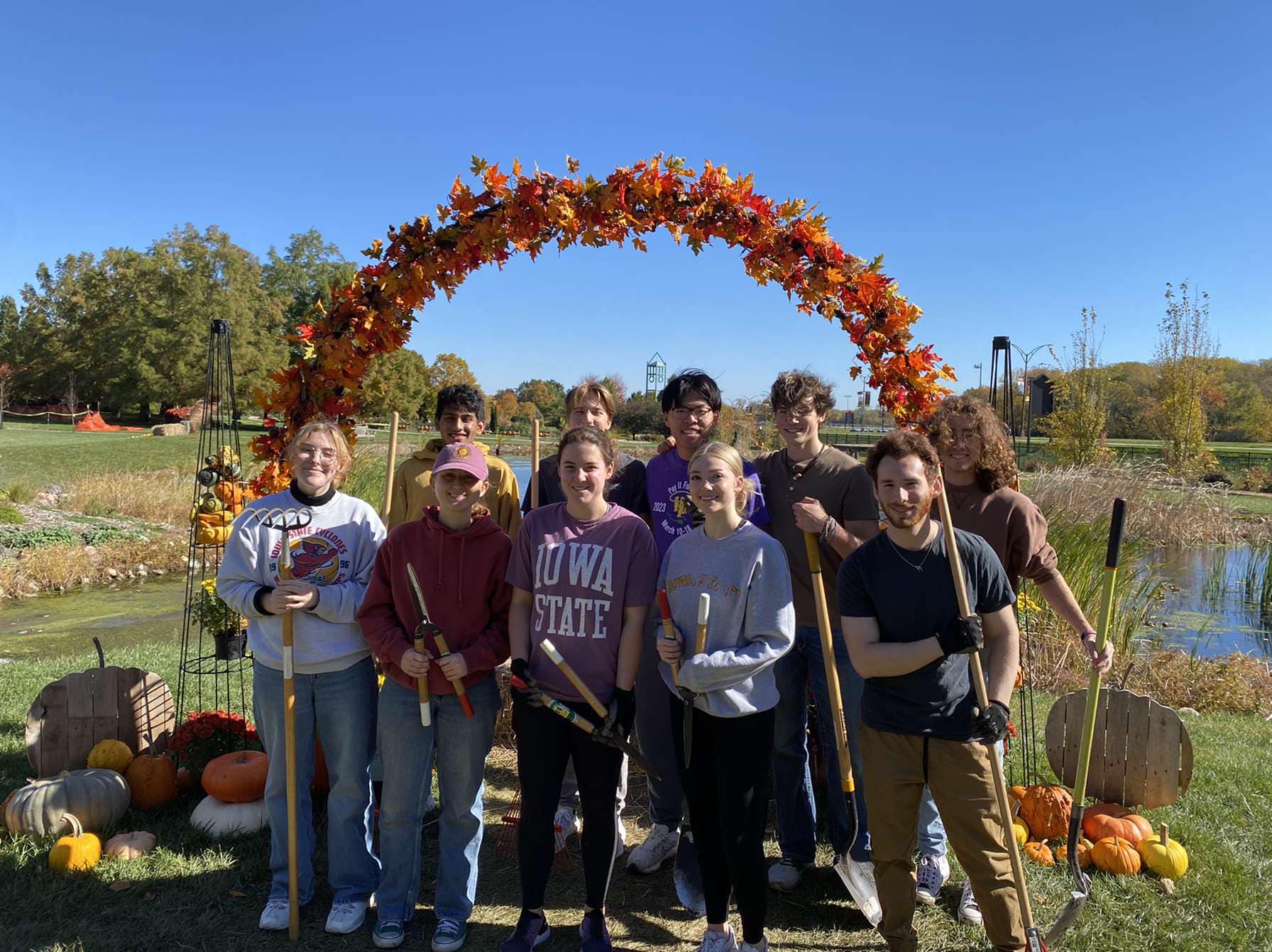 Volunteers posing with their tools after a volunteer shift.