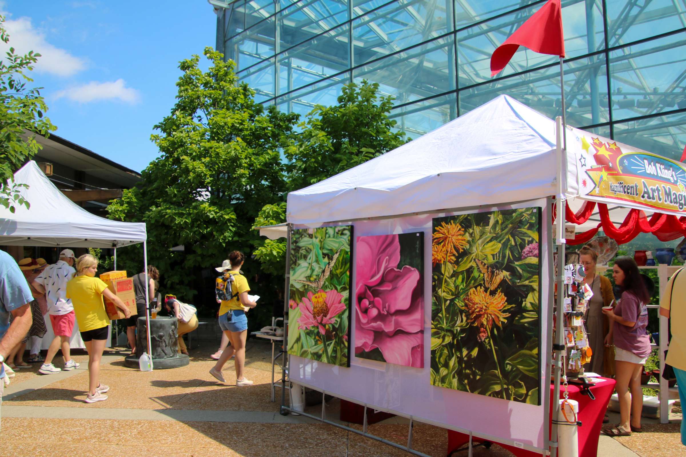 Tents are set up and decorated with wares to be sold at the Garden Art Fair.