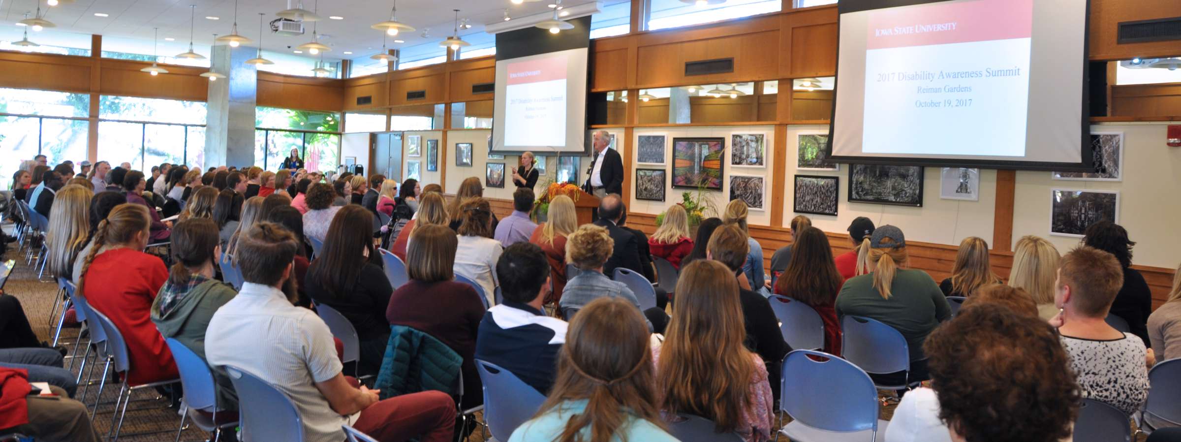 Room filled with conference attendees and speaker