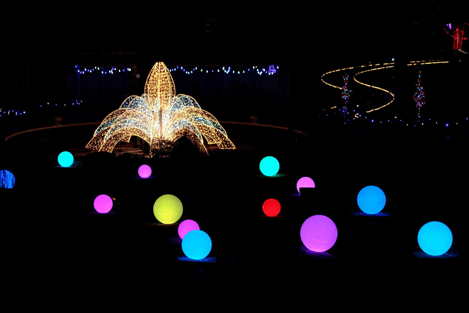 Lighted fountain and colorful lighted orbs